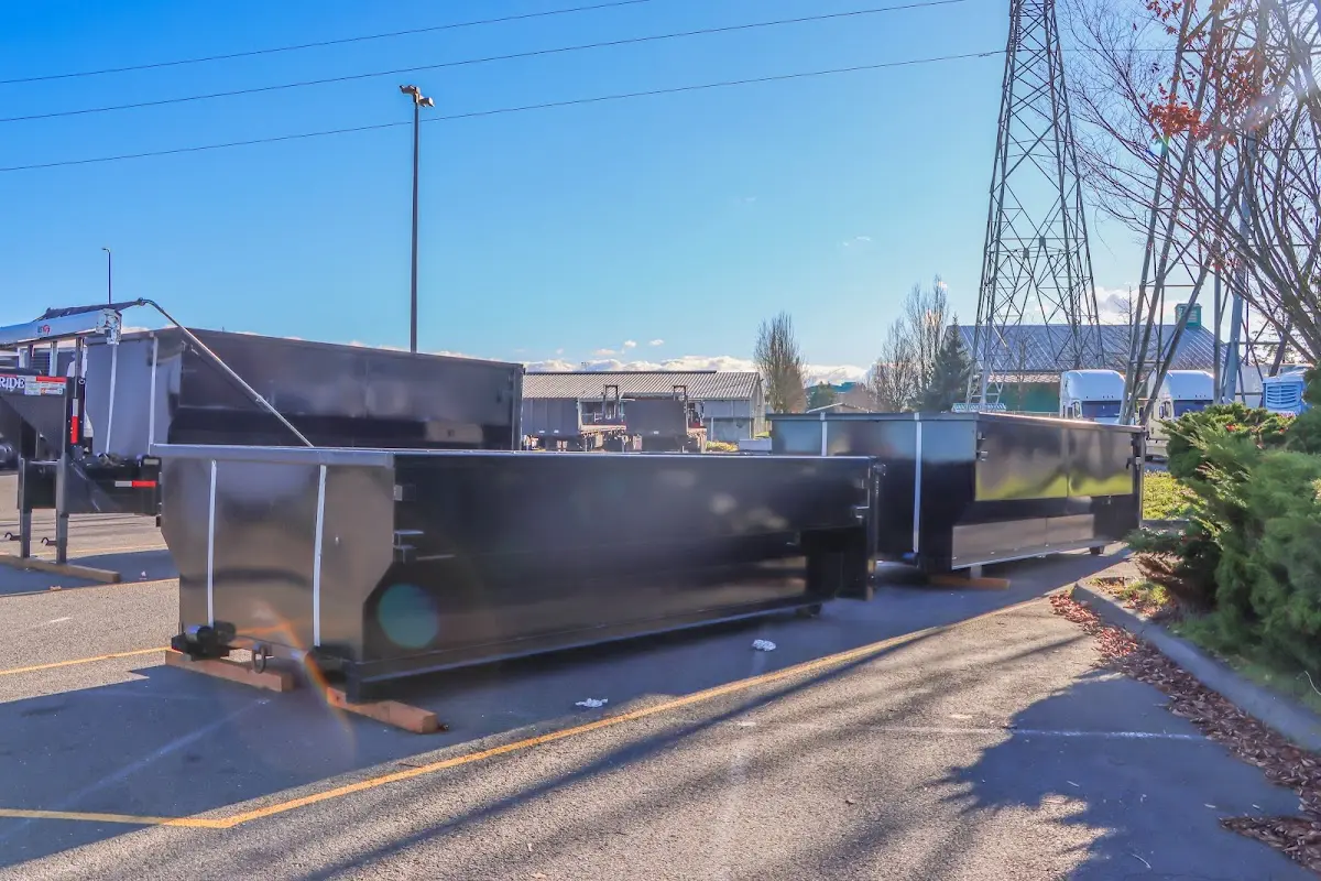 Roll-off dumpster ready for waste disposal at job site for Concrete Dumpster Rental in Tallahassee